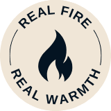 Circular badge with a flame icon in the center and the wordsREAL FIRE" above and "REAL WARMTH" below.