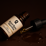 Fragrance Collection (3x) Bourbon Vanilla essential oil bottle with dropper and spilled oil, emphasizing purity and quality.