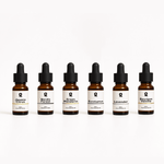 Six amber glass dropper bottles labeled with different essential oil scents: Jasmin Citrus, Nordic Forest, Green Mandarin, Eucalyptus, Lavender, and Bourbon Vanilla.