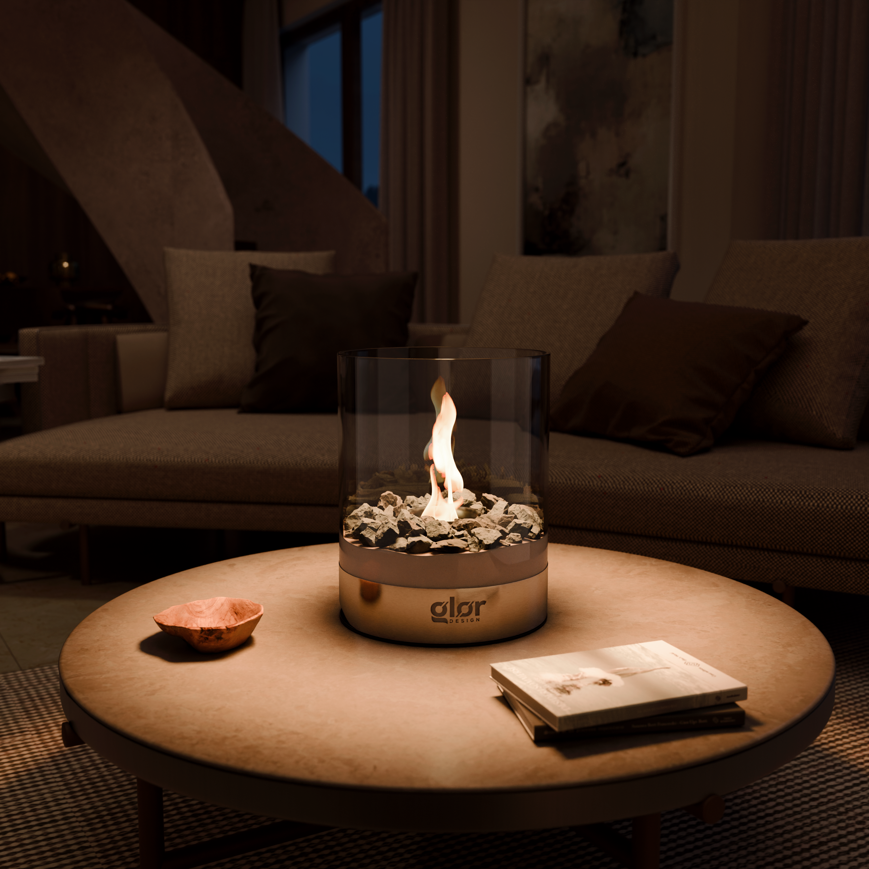 Ritual-Set tabletop fire pit with glass cylinder and decorative stones by Glør, placed on a modern round coffee table in a cozy living room.